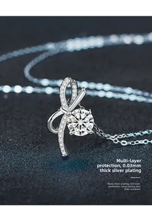 Detail of s925 silver bow pendant with moissanite and long-lasting nano-plating