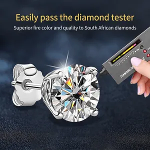 Classic moissanite four-prong silver earrings shown passing a diamond tester test