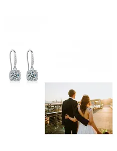 Detailed macro of 925 sterling silver moissanite halo drop earrings for wedding events