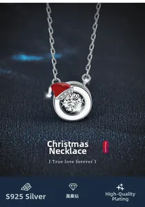 Macro view of S925 sterling silver necklace with moissanite and festive red Santa hat