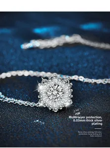 Macro view of 925 silver snowflake pendant with moissanite and thick plating detail