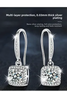 Detailed view of silver halo drop earrings with square moissanite stones and plating finish