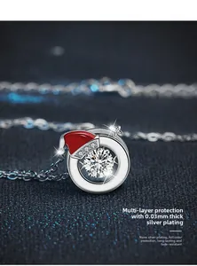 Detail of Christmas necklace with Santa hat pendant and multi-layer silver plating