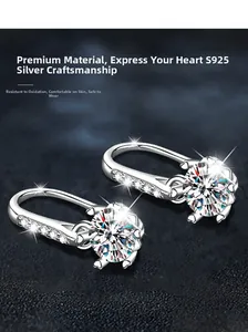 Detailed view of S925 sterling silver hook earrings with round moissanite and heart accents