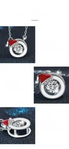 Detail of S925 silver necklace with moissanite pendant and festive red Christmas hat