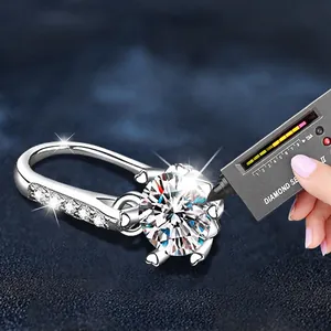 Classic 925 sterling silver six-prong moissanite ring featuring a detailed hollow heart band