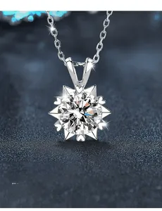Macro shot of 925 sterling silver snowflake pendant with moissanite center stone