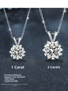 Detail of 925 sterling silver snowflake necklaces with 1 and 2 carat moissanite pendants