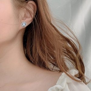 Elegant S925 sterling silver dragon year stud earrings with moissanite on female model