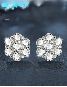 Macro view of flower-shaped Moissanite stud earrings in 925 sterling silver settings