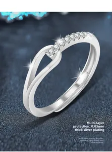 Macro shot of silver adjustable ring featuring double-layer hollow design and pave zircons