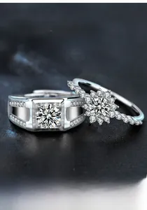 Close-up of S925 sterling silver couple rings with moissanite stones and snowflake detail
