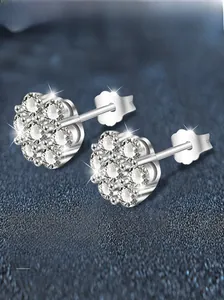 Macro view of S925 sterling silver floral cluster earrings with sparkling cubic zirconia