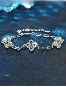 Macro shot of S925 sterling silver four-leaf clover bracelet with 3EX cut moissanite stones