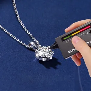 925 Sterling Silver Moissanite snowflake necklace shown being tested with a diamond pen