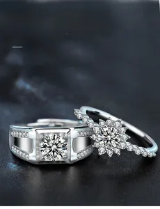 Macro detail of 925 sterling silver couple rings with 3EX cut moissanite on black leather