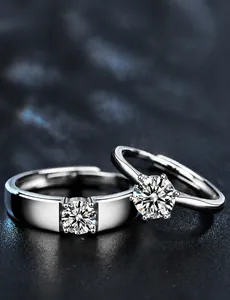 Macro shot of 925 silver couple rings with moissanite stones and 3EX cut details
