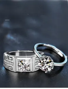 Macro shot of 925 silver rings showing 3EX cut moissanite with 58 facets and grecque pattern