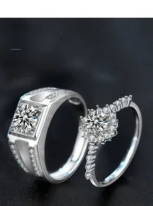 Macro detail of S925 sterling silver couple rings with square and sunflower diamond settings