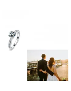 Close-up of four-prong round moissanite ring with side stones and romantic couple scene