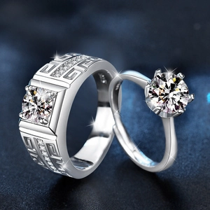 S925 sterling silver couple rings set with moissanite stones on starlit blue background