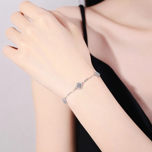 Elegant S925 silver paperclip chain bracelet with light blue clover gemstone pendants