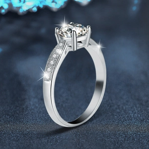 Classic S925 sterling silver ring with four-prong moissanite setting and side micro-pavé diamonds