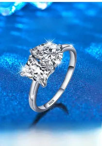 Detail of S925 silver ring featuring pear and princess cut moissanite stones