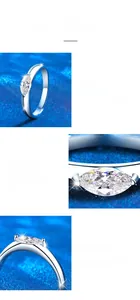 Macro detail of marquise cut moissanite ring with classic claw setting on silver band