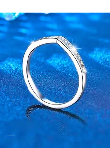 Macro shot of V-shaped S925 sterling silver ring with delicate pave moissanite stones