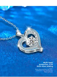 Detail of s925 silver heart pendant engraved with I love you to the moon and back