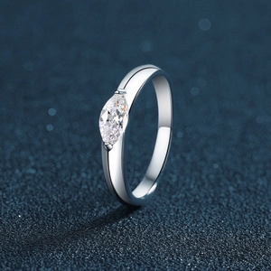 Elegant s925 silver marquise-cut moissanite solitaire ring on a dark starry background