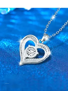 Macro shot of S925 sterling silver heart pendant with a sparkling round-cut stone