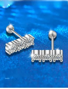 Detail of S925 sterling silver screw back earrings with three sparkling moissanite stones