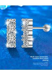 Macro shot of S925 sterling silver three-stone screw-back earrings with polished finish