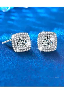 Macro detail of square halo moissanite earrings with 925 silver plating on dark background