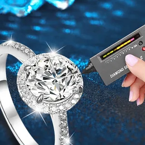 Exaggerated 925 silver moissanite ring passing diamond tester against blue background