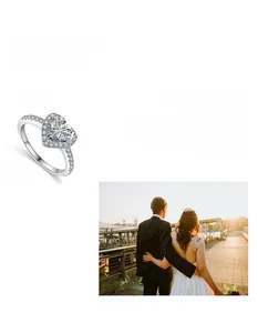 Close-up of heart-shaped moissanite ring with micro-pave diamonds on silver band