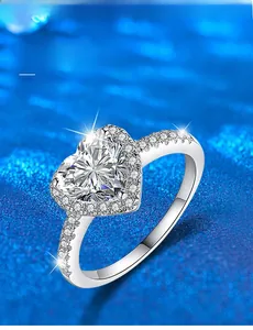 Macro shot of 925 silver heart ring showing 3EX cut moissanite and halo setting