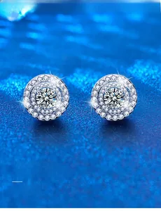 Detailed macro view of silver round stud earrings featuring 3EX cut moissanite stones