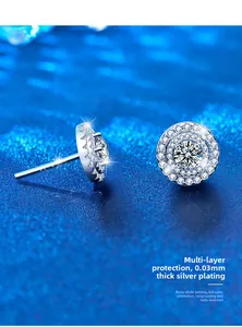 Macro shot of silver round halo stud earrings showing dual layer pave setting detail