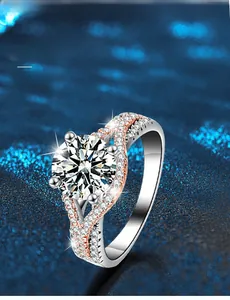 Macro detail of 925 silver moissanite ring with two-tone twist and 3EX cut diamond