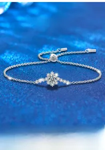Macro shot of S925 silver snowflake bracelet featuring a brilliant moissanite center stone