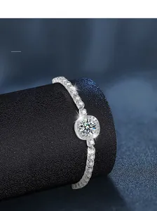 Macro shot of S925 sterling silver bracelet with halo setting moissanite on jewelry roll