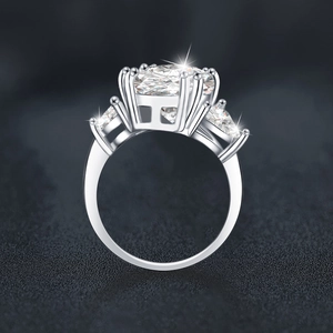 Three-stone 925 silver ring featuring 5-carat oval and pear-cut moissanite stones