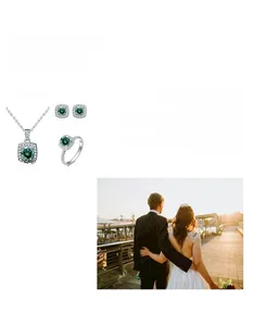 Three-piece silver jewelry set featuring emerald-green square stones and sparkling accents