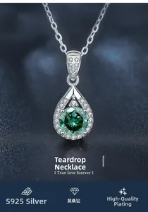 Detail of S925 silver pear-shaped necklace with green moissanite in prong setting