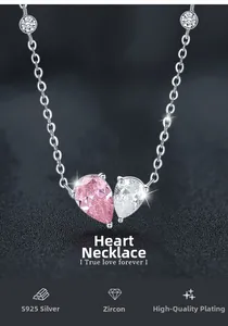 Macro shot of S925 silver heart necklace with pink and white pear-cut cubic zirconia