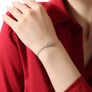 Elegant 925 sterling silver snowflake bracelet with sparkling moissanite on a model's wrist