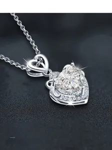 Detailed close-up of S925 silver necklace featuring a large heart-cut moissanite pendant